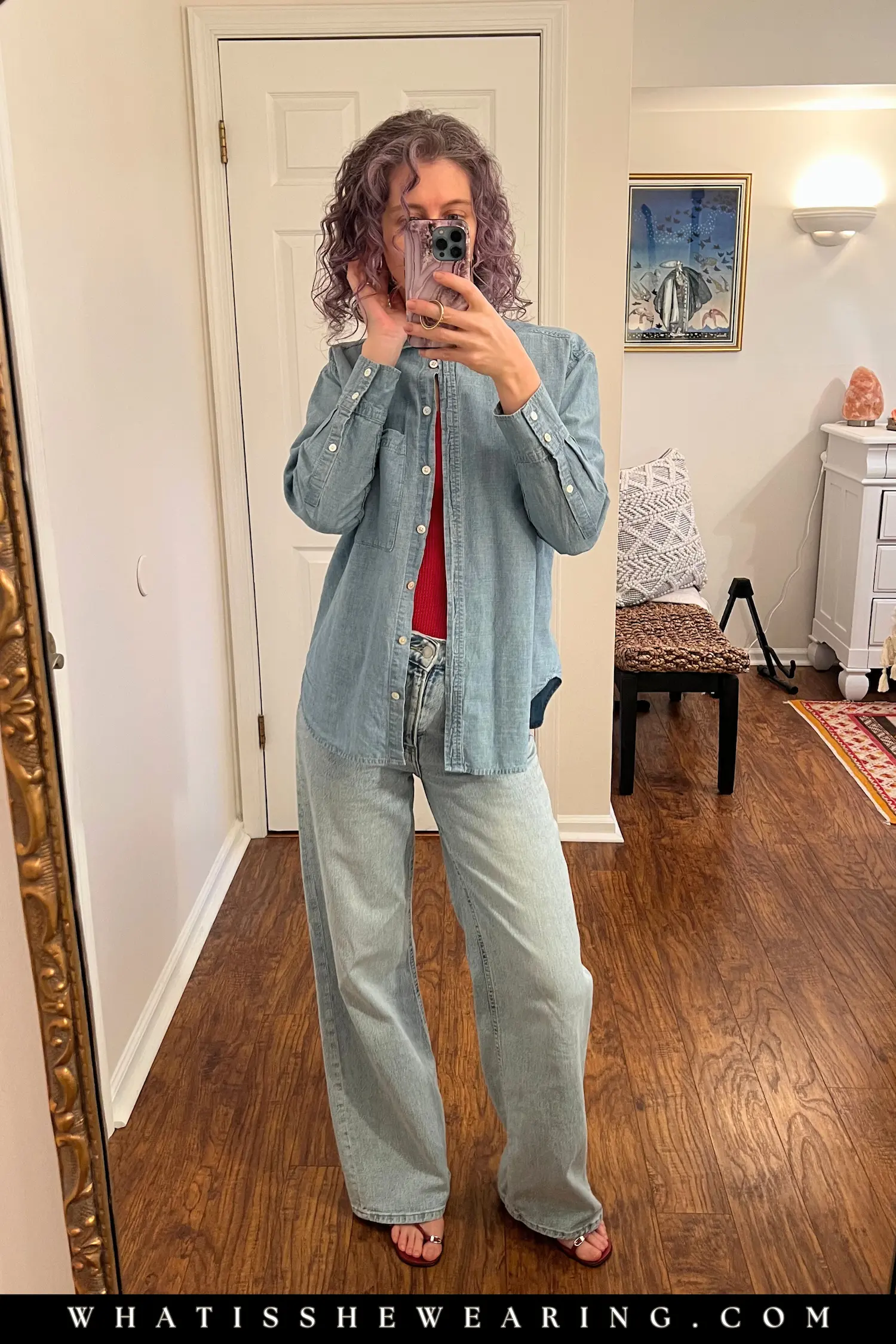 Cool girl denim-on-denim outfit with a light-wash shirt and relaxed jeans.