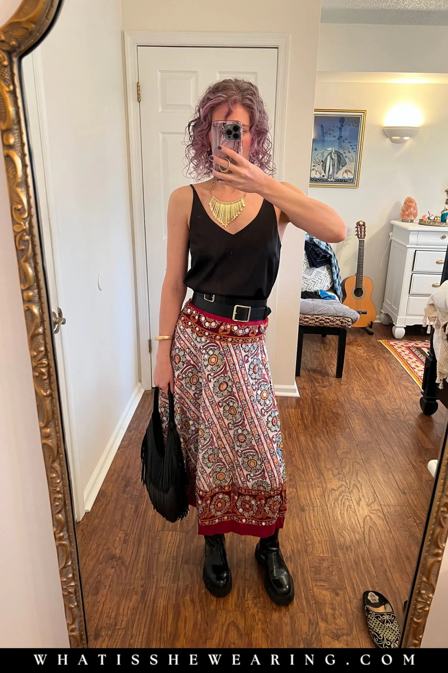 Dopamine concert outfit with a boho chic sequin skirt, satin cami, black chunky boots, and gold and  black statement accessories.