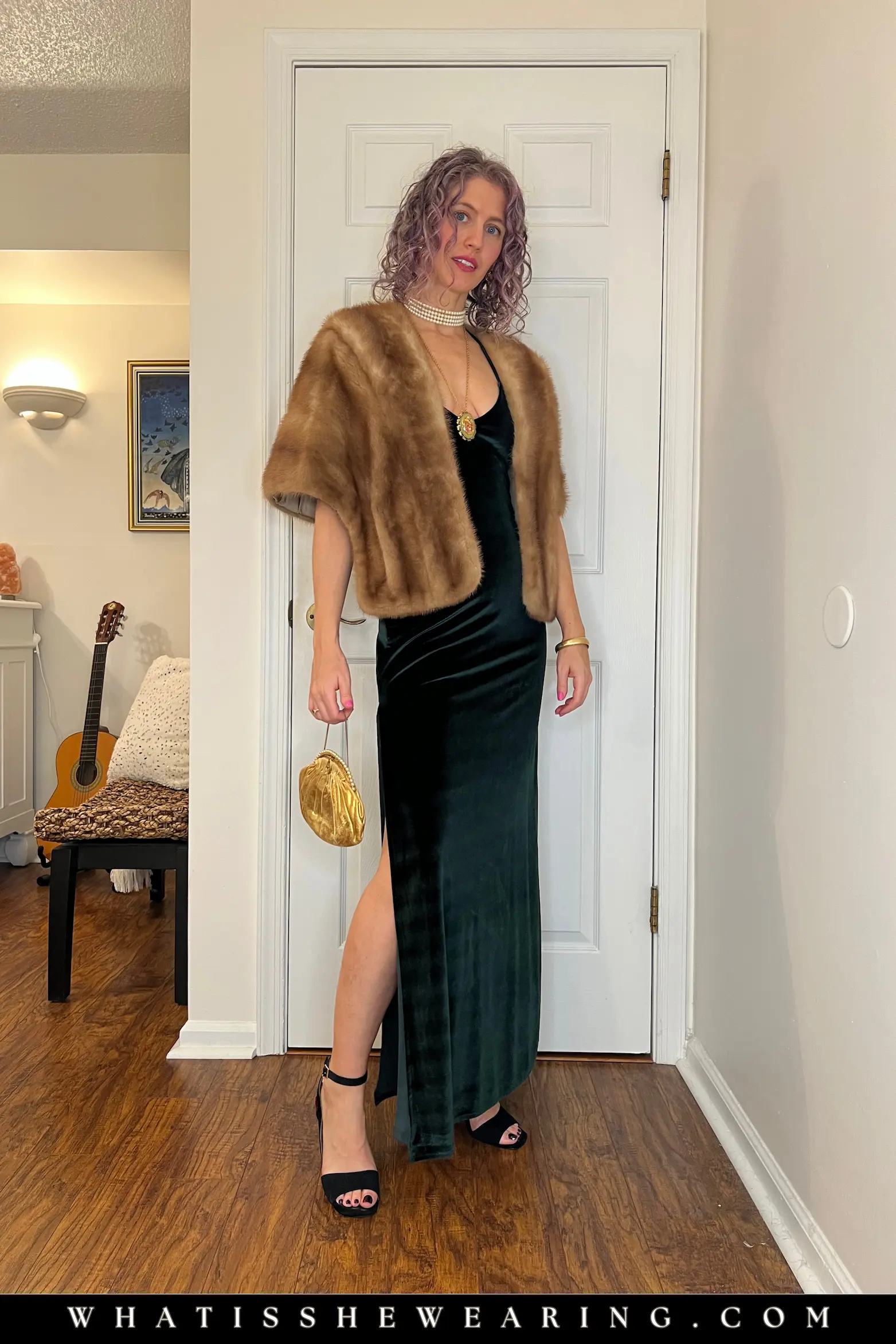 Emerald Velvet Dress Jewel Tone Glow Timeless 1920s-inspired emerald green velvet floor-length gown with faux fur cape, pearl choker, heeled sandals, and gold purse for elegant holiday dress ideas.