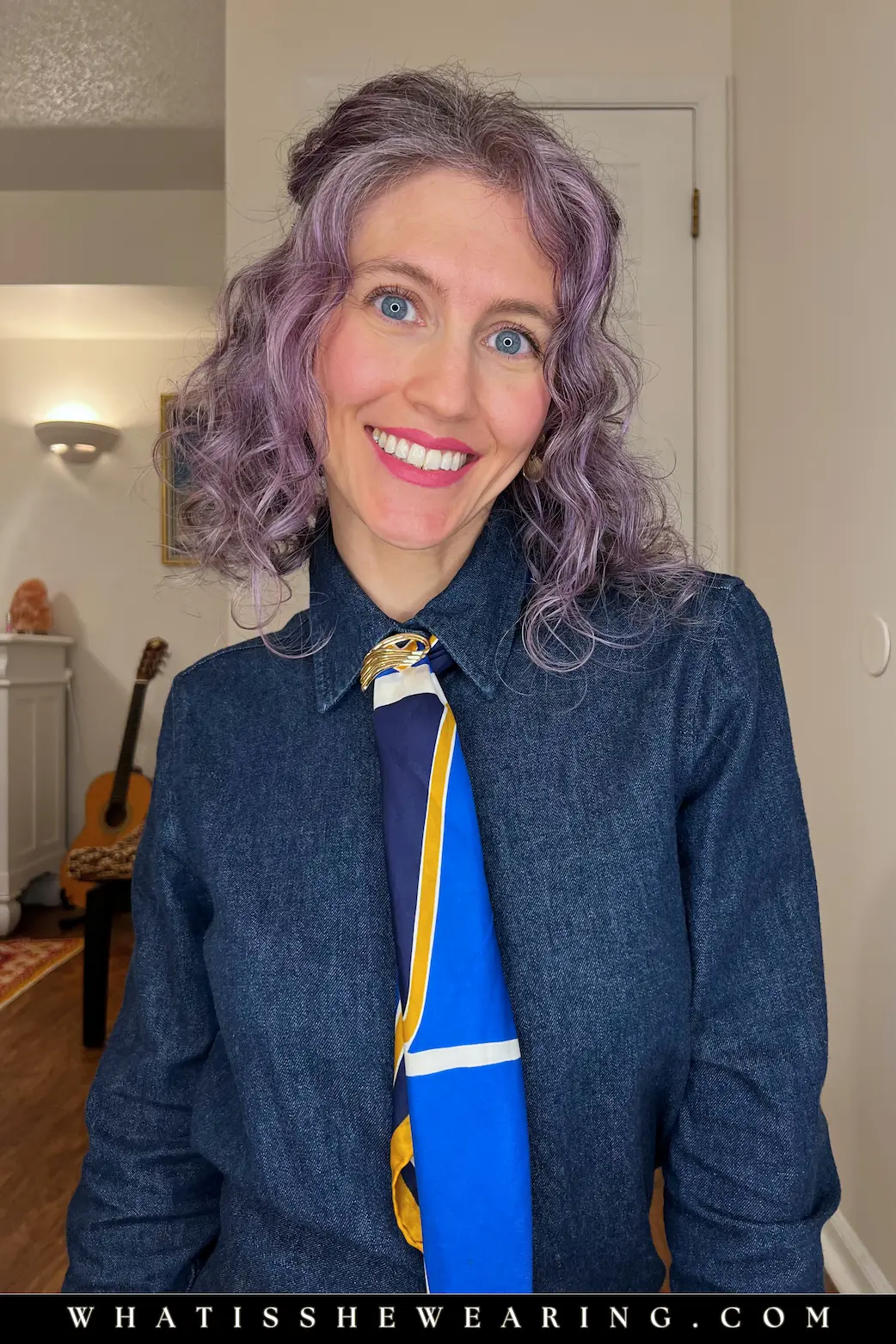 La Garçonne Neck Tie Close-Up La Garçonne neck tie: close-up of slim silk scarf draped like a tie on collar