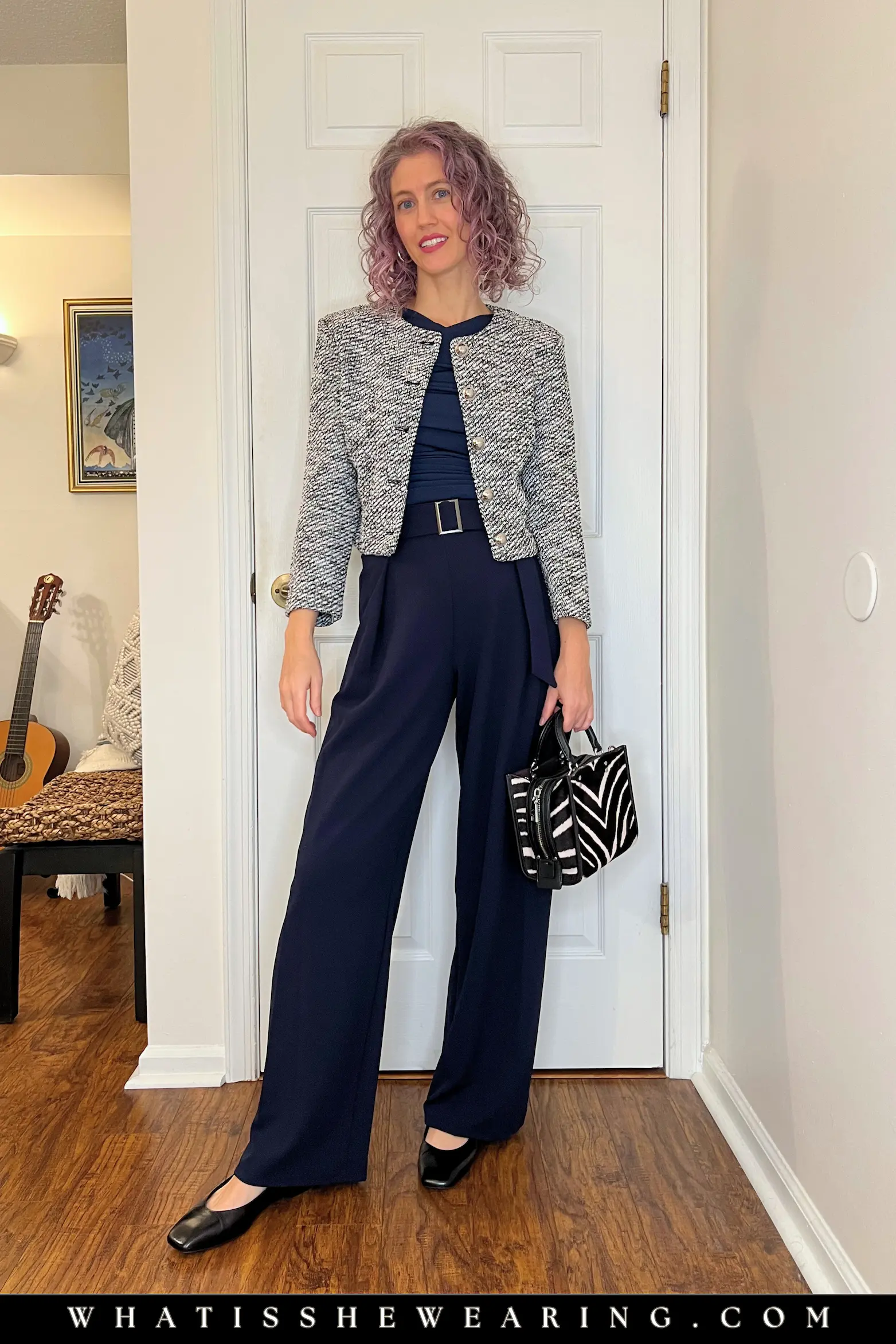 Classic Navy with Black-White Patterns Woman wearing classic navy blue outfit with black and white patterned separates—what to wear with navy blue for harmonious neutral pattern play and eclectic work chic.