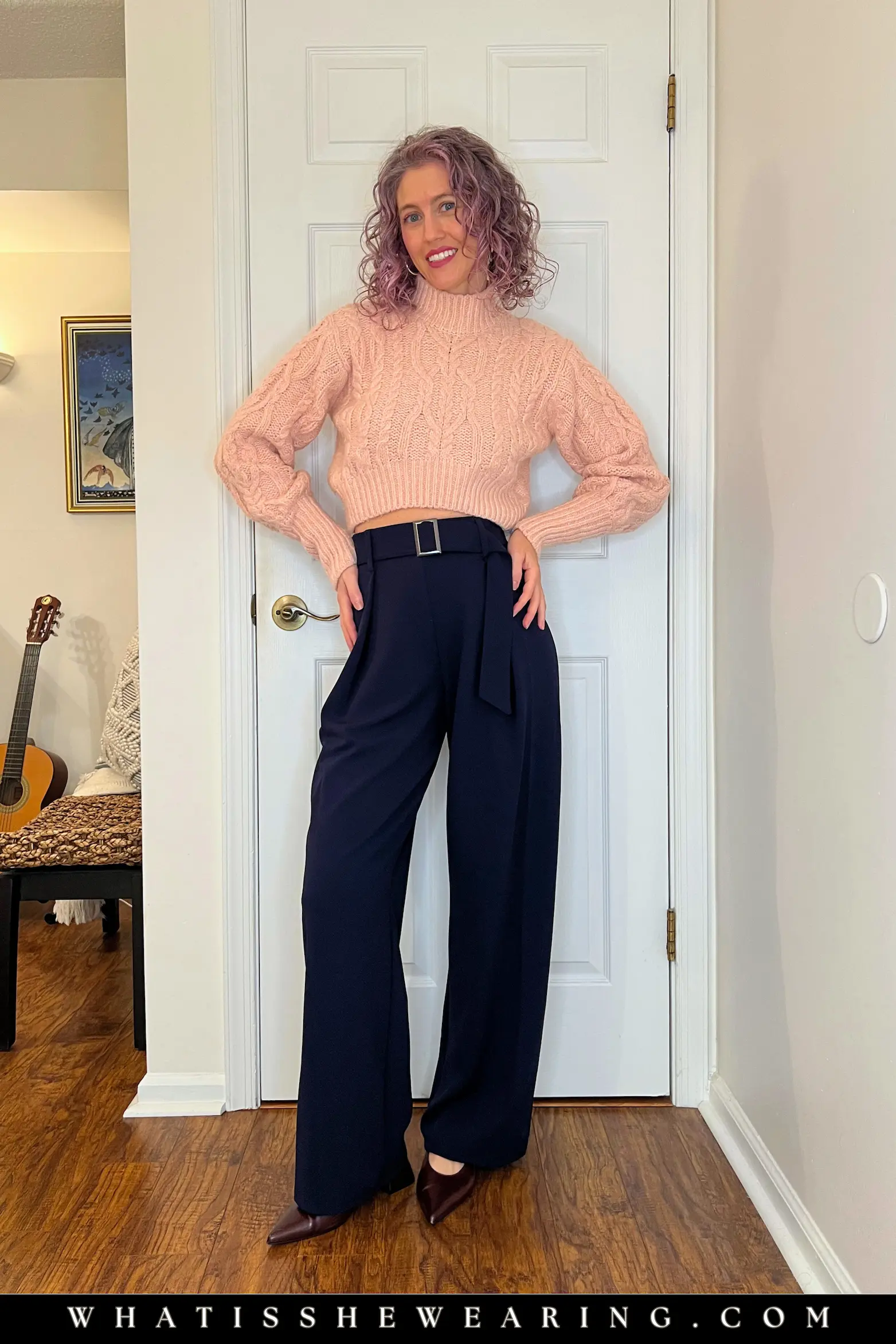 Winter Navy Blue with Blush Pink Sweater Woman in navy blue winter outfit with blush pink sweater and wool trousers—what to wear with navy blue for romantic glow and playful feminine softness.
