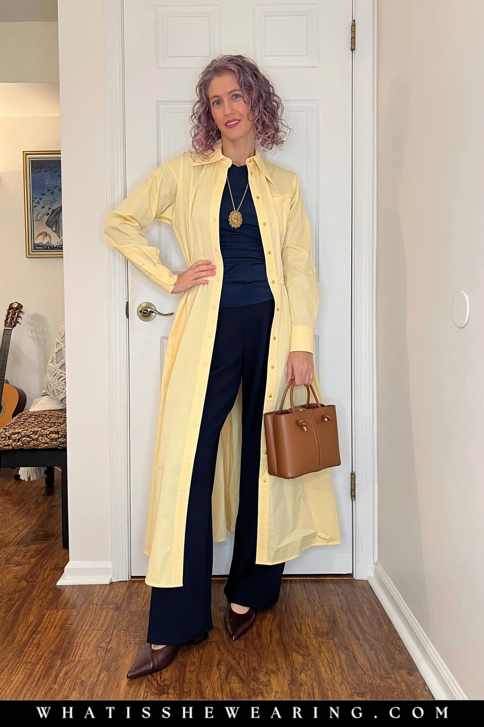Spring Navy with Butter Yellow Trench Woman styling navy blue spring outfit under a whimsical butter yellow trench coat—what to wear with navy blue for classy, brightening vibes and unexpected chic.
