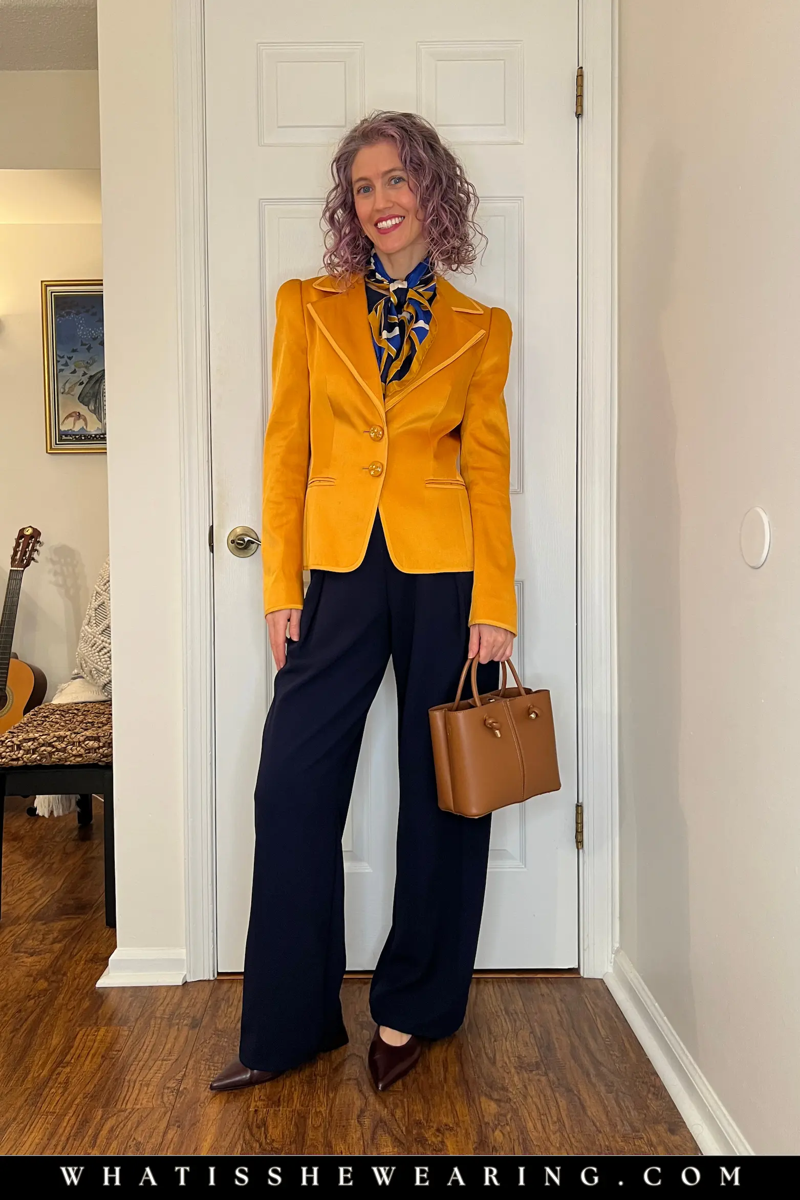Classic Navy with Citrine Gold Blazer Woman styling citrine gold blazer, patterned scarf, and navy blue pants—what to wear with navy blue for contrasting glamour and jewel-toned fall power elegance.