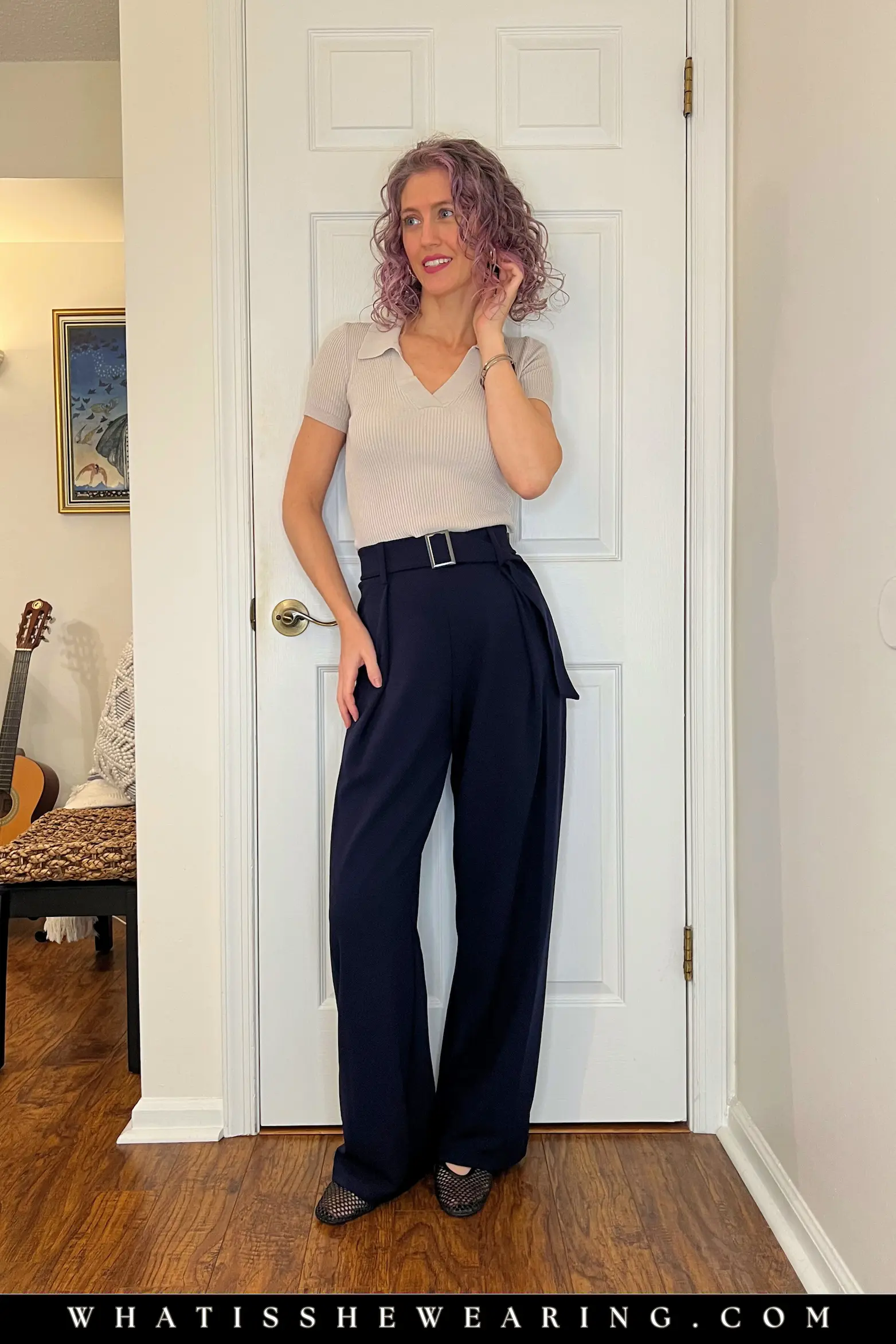 Casual Navy and Gray Knit Outfit Idea Woman styling casual navy blue outfit with a soft gray knit polo top—what to wear with navy blue for modern minimalism and effortless cool in quiet luxury fall layers.