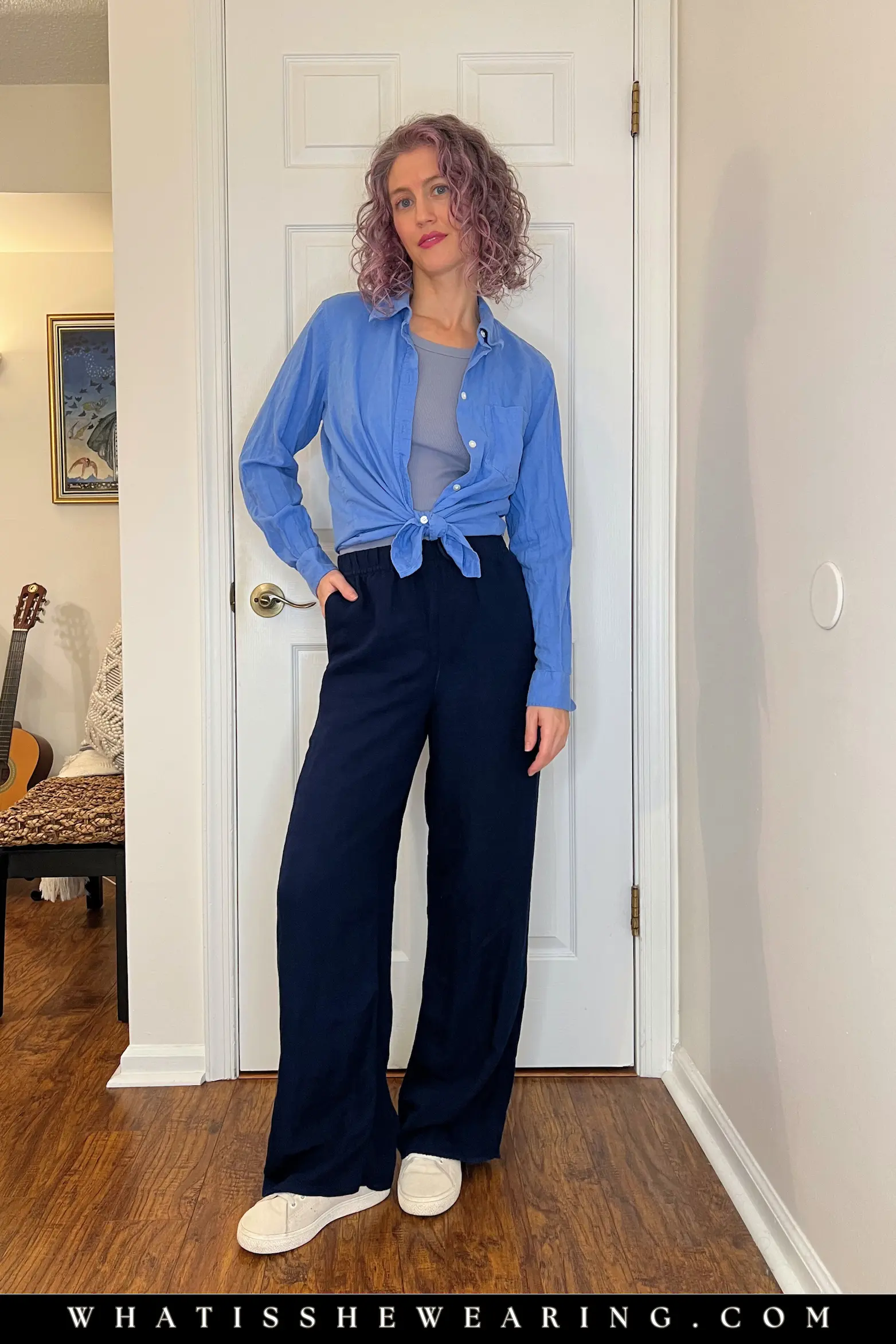 Summer Navy Tonal Blues Outfit Woman in navy blue summer outfit with breezy linen tonal separates—what to wear with navy blue for monochromatic magic and casual European sophistication.