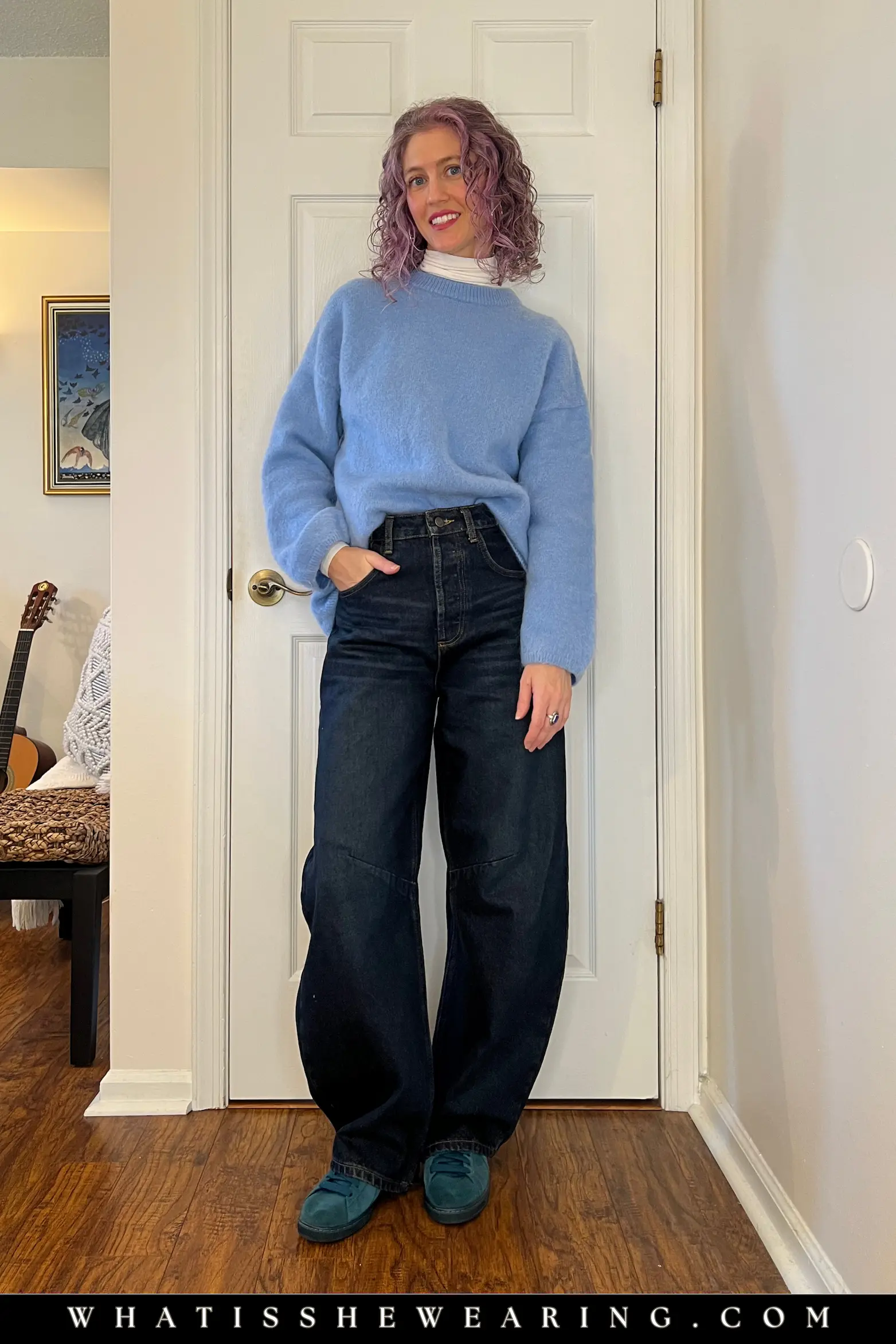 Blue Oversized Sweater Layered with Barrel Jeans and Suede Sneakers How to style an oversized sweater: Blue knit layered over a turtleneck with barrel leg jeans and suede sneakers for casual winter comfort.