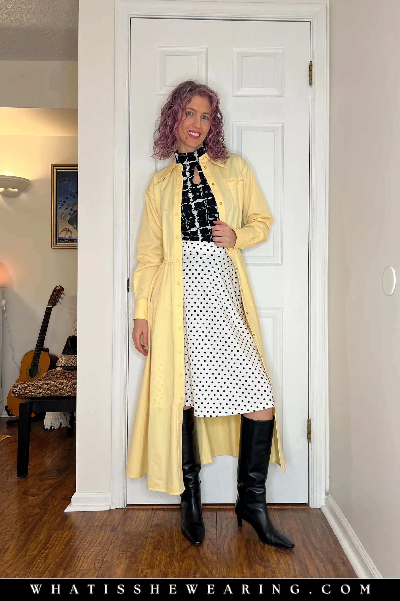 Hack 2: Wear a Shirt Dress as a Lightweight Coat Woman wearing a patterned top and polka dot skirt styled with a yellow shirt dress worn open as a coat