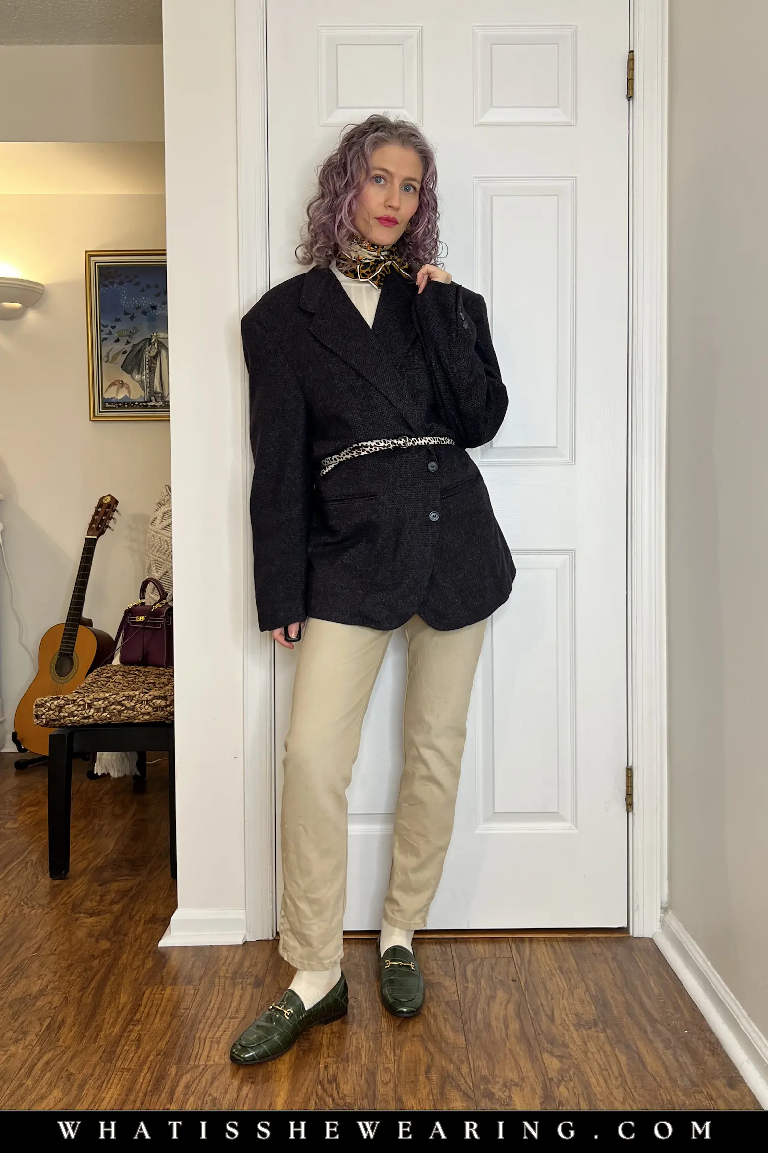 Oversized Boxy Blazer Cinched Over Beige Straight-Leg Jeans Woman in classic straight-leg beige jeans, loafers, silk scarf, and oversized boxy blazer cinched at the waist for polished spring transition