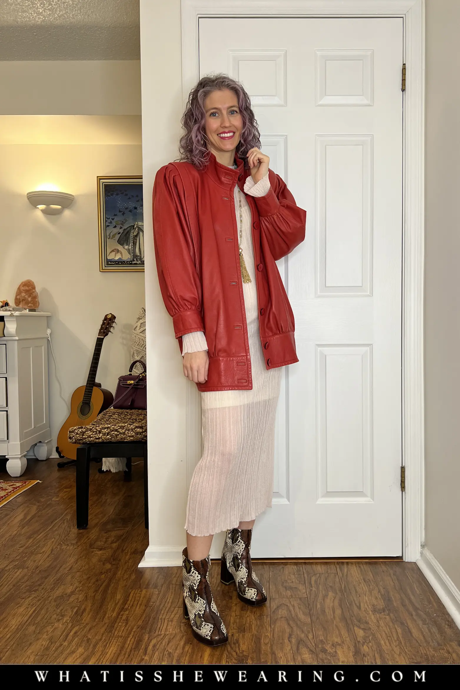 Red Leather Bomber Jacket with Sheer Pink Midi Dress Woman in sheer pink midi dress layered with red leather bomber jacket and snake print ankle boots, edgy spring jacket outfit idea