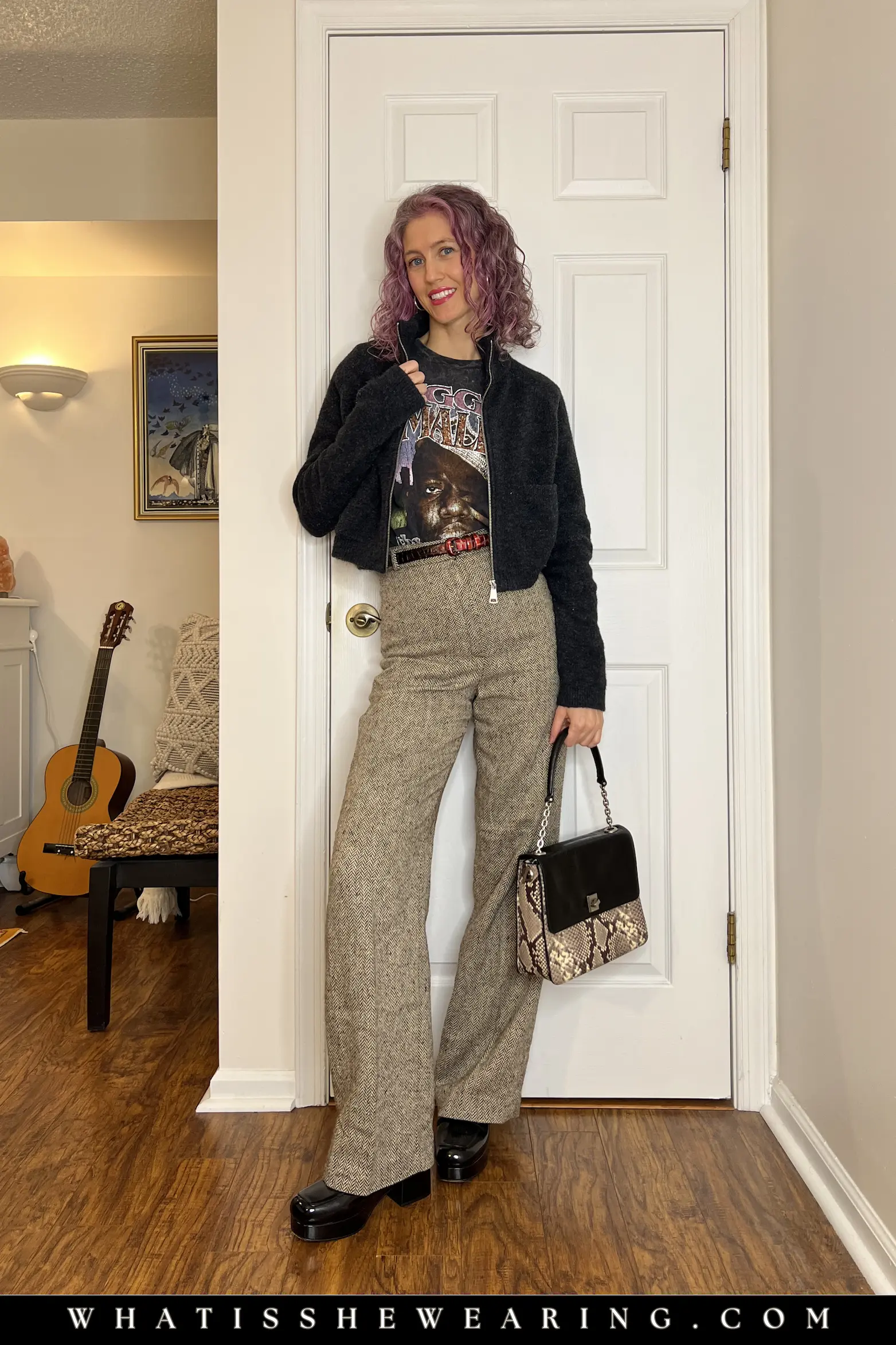 Elevated Casual Spring Layering Outfit Elevated casual spring transitional outfit: gray knit bomber jacket over graphic t-shirt, wool trousers, black patent loafers, and snake embossed leather shoulder bag for chic outings