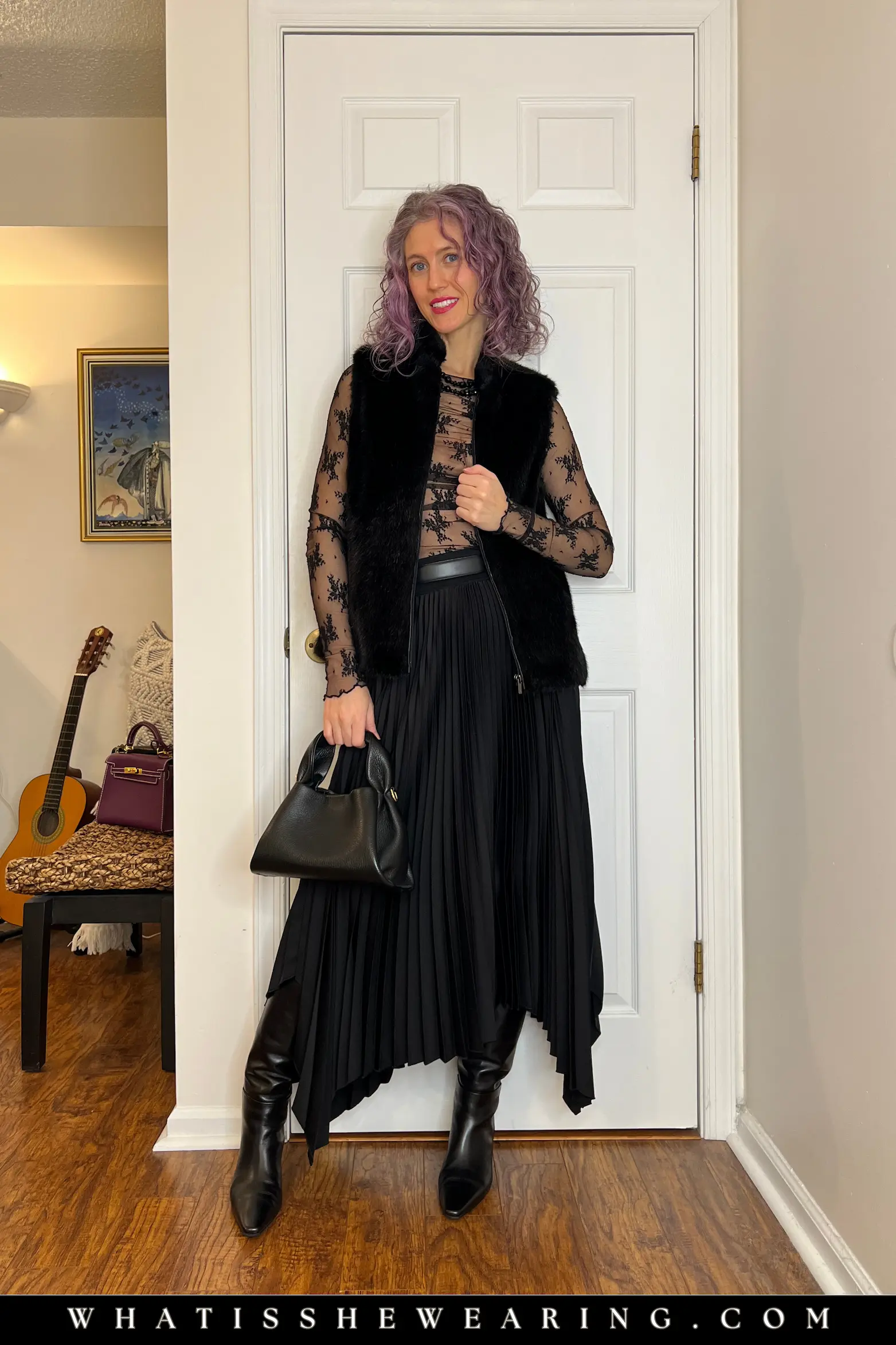 All-Black Outfit: Asymmetric Pleated Midi Skirt Timeless runway trend example: all-black outfit with asymmetric pleated midi skirt, sheer lace top, faux fur vest, tall boots for dark feminine energy