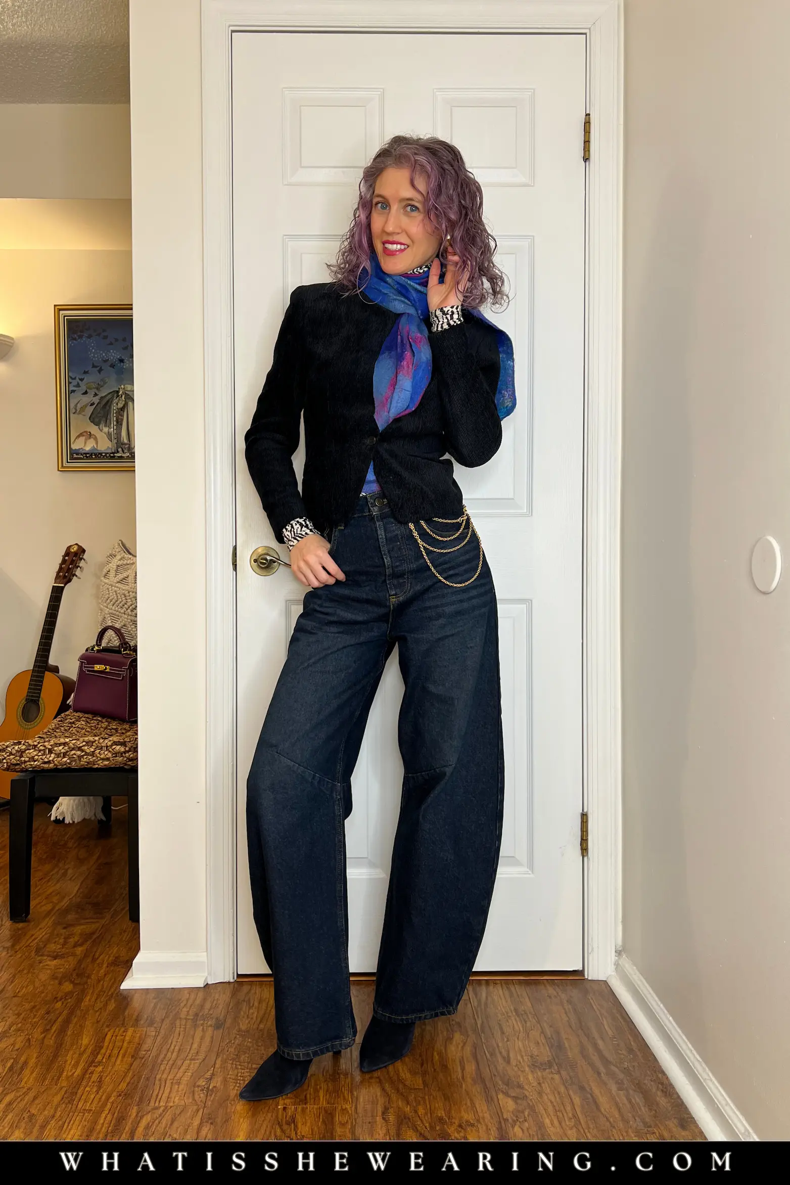 Layered Look: Thrifted Navy Jacket Story Timeless runway trend example: layered outfit with thrifted navy jacket over zebra turtleneck, barrel-leg jeans, handmade scarf, suede boots, Y2K chain for personal story