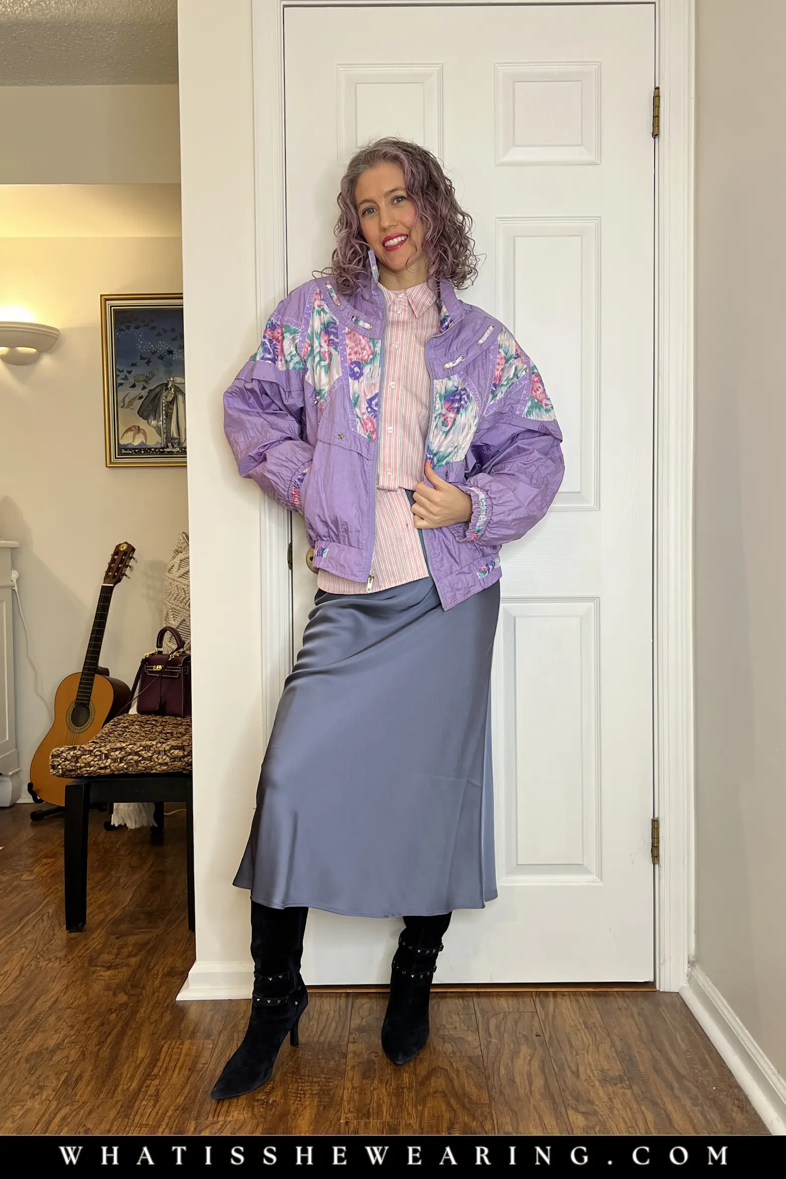 Vintage Floral Windbreaker with Striped Button-Down Woman in striped button-down shirt, slip skirt, tall boots, and playful vintage floral windbreaker, sporty spring jacket casual look