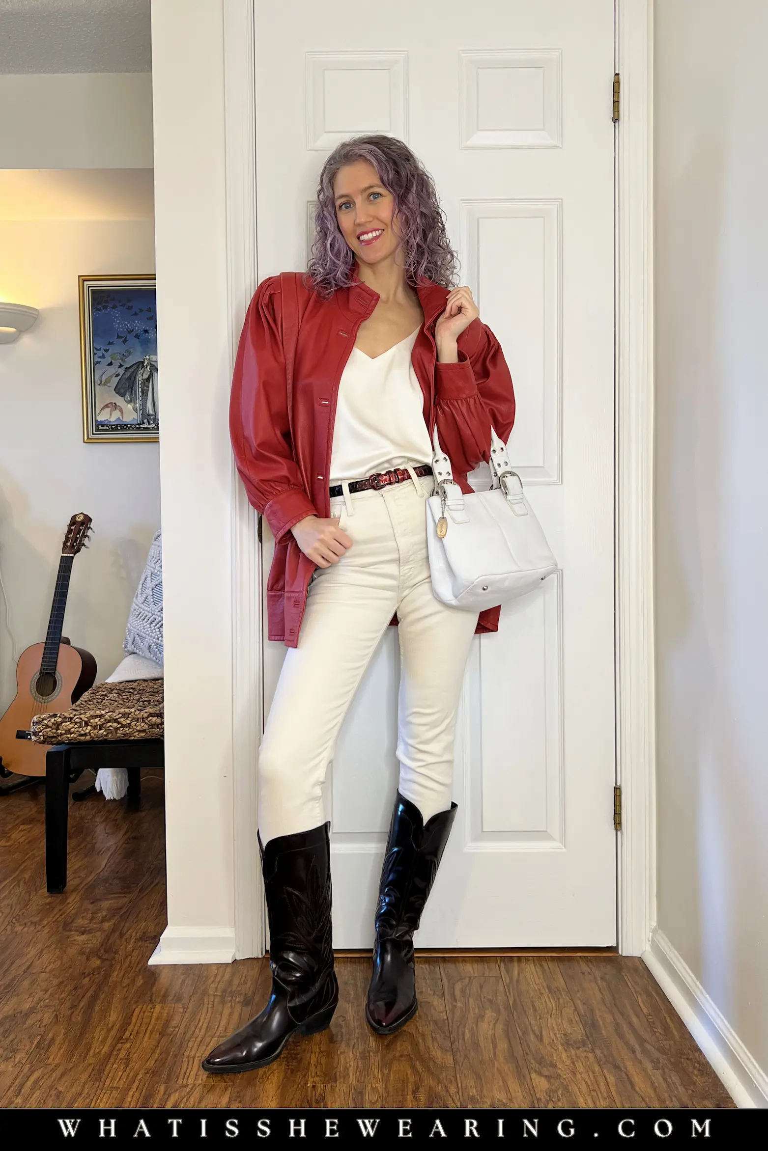 Bomber Jacket and Jeans Outfit with Western Boots Stylish woman in a red leather bomber jacket, ivory tank and ivory jeans with cowboy boots, casual outfit idea for everyday wear
