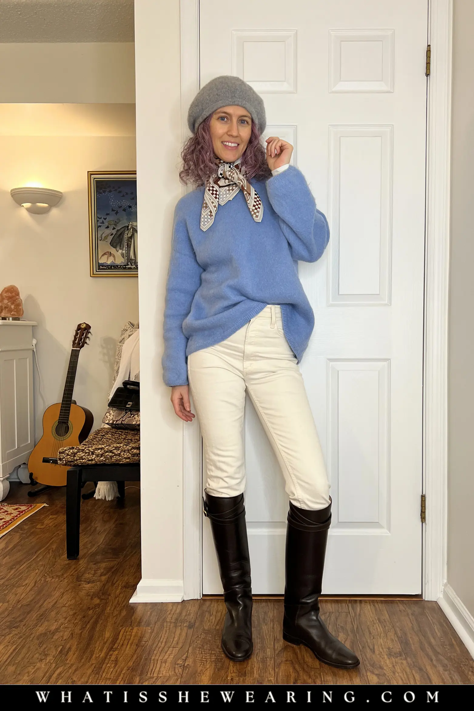 Chunky Knit Sweater and Jeans Outfit Formula Stylish woman wearing a cornflower blue chunky knit sweater with ivory skinny jeans, brown riding boots and a patterned silk scarf - classic everyday outfit