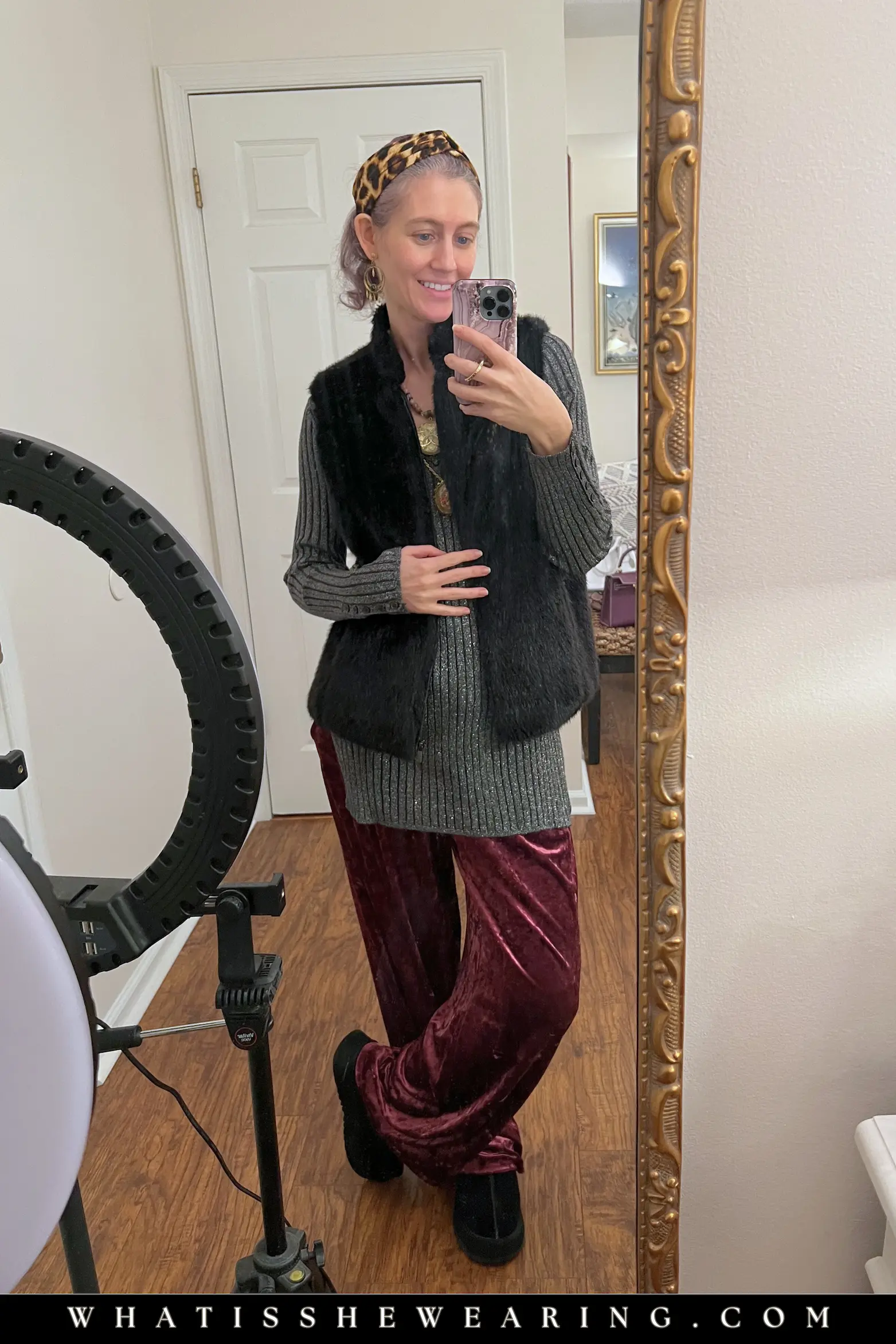 Faux Fur Vest and Elevated Lounge Pants Outfit Woman in a black faux fur vest, long sleeve tunic top with burgundy velvet lounge pants and sneakers - comfortable everyday outfit