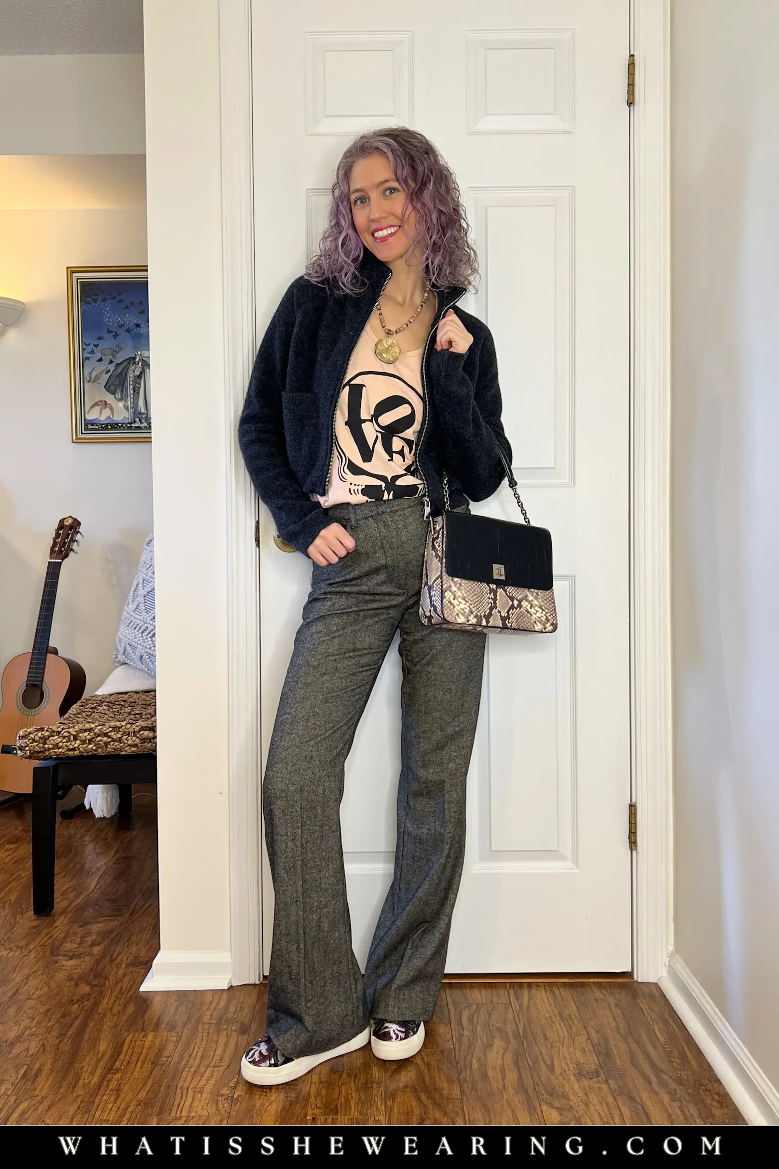 Graphic Tee and Relaxed Trousers Casual Outfit Stylish woman in a pale pink graphic tee with relaxed trousers, a gray cardigan and sneakers, easy everyday outfit idea