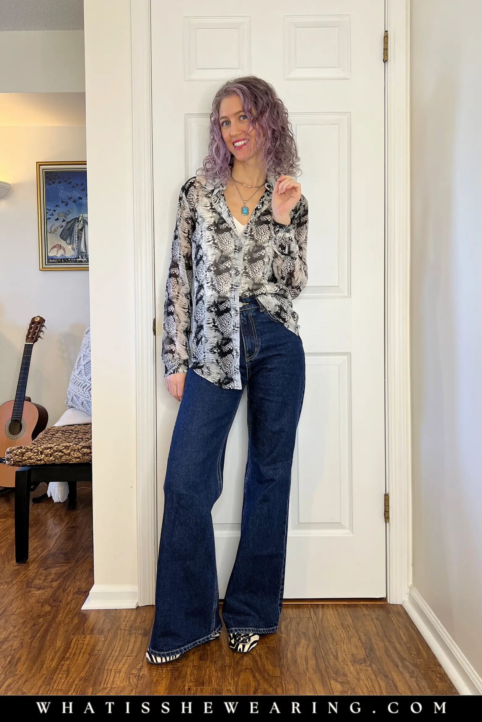 Patterned Blouse and Relaxed Denim Outfit Idea Stylish woman in a snake print patterned blouse with relaxed dark denim and ballet flats, simple casual everyday outfit