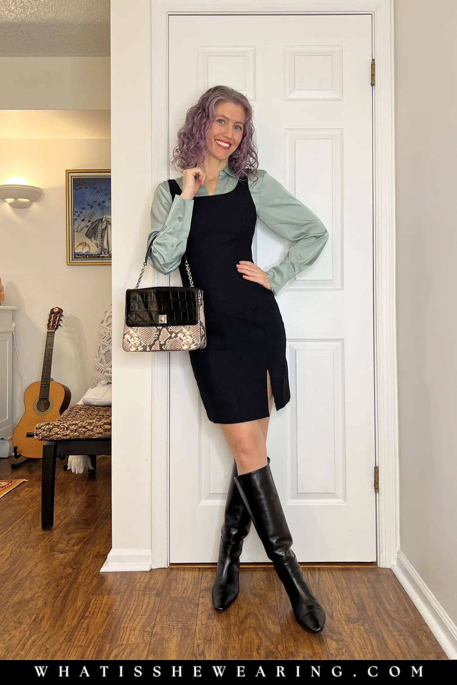 Outfit Idea 1: LBD with Sage Silk Blouse Layering Woman in black LBD shift dress layered over sage green satin blouse, styled with black tall boots and animal print shoulder bag for spring office chic